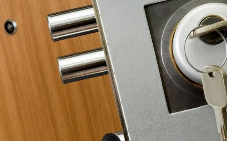 business locksmith replacing door hardware in Austin Texas